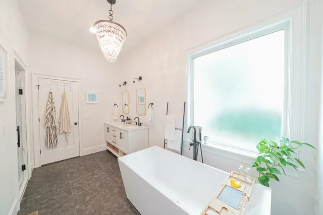 a bathroom with a granite countertop sink a shower and a mirror