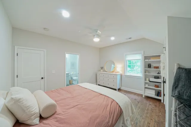 a bathroom with a toilet and a shower curtain