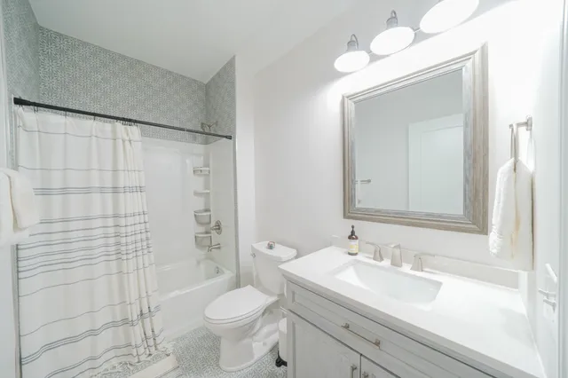 a view of a patio with a table chairs and a backyard