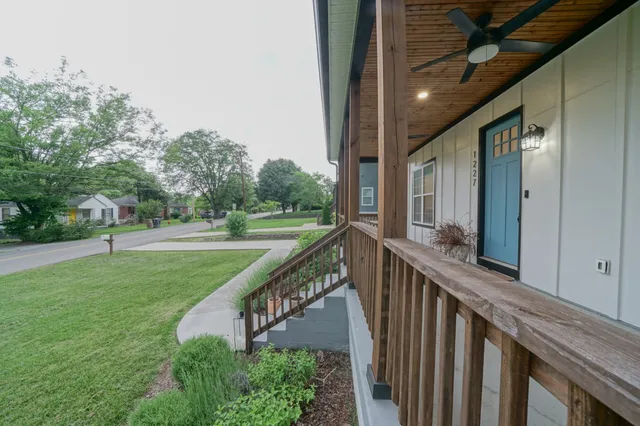 a view of a house with a yard from a balcony