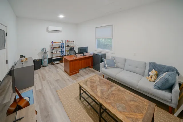 a room with furniture and a flat screen tv