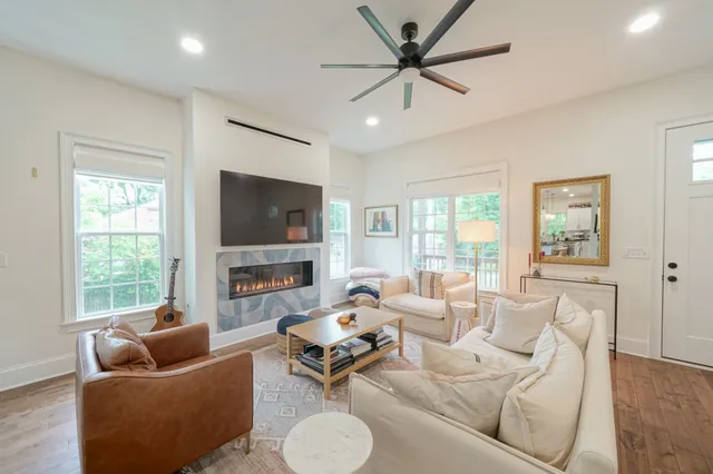 a living room with furniture and a flat screen tv