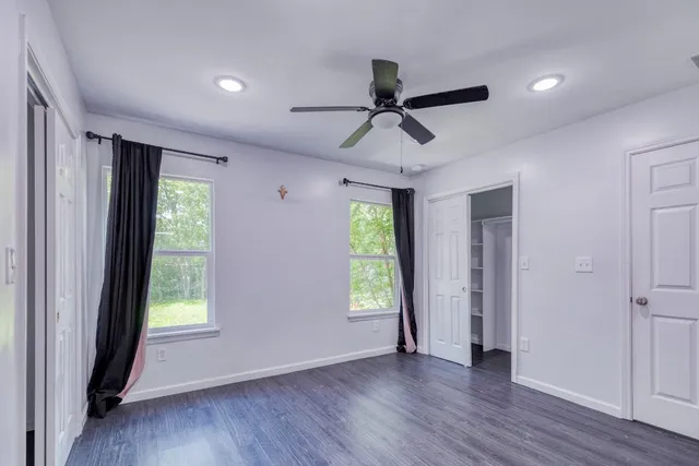 a view of room with window and hardwood floor