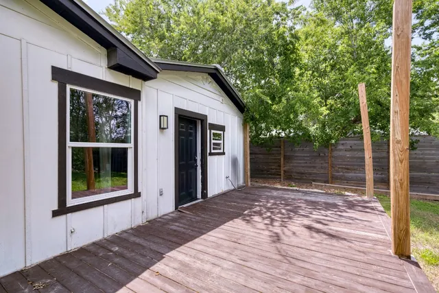 a backyard of a house with seating space