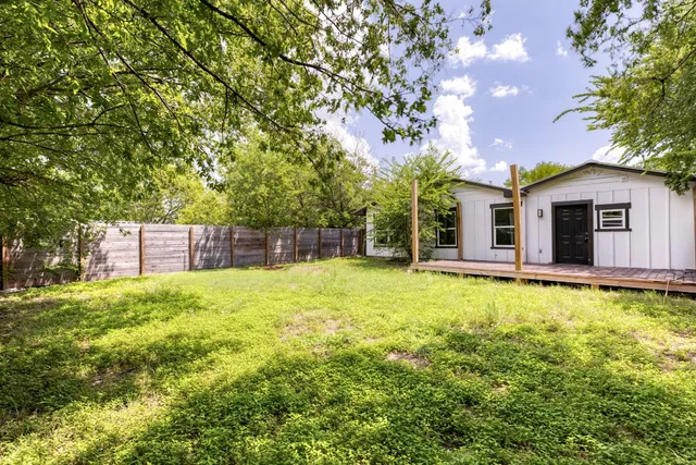 a backyard of a house with lots of green space