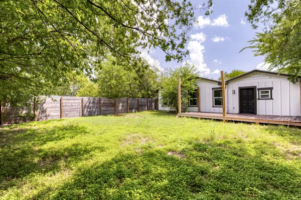 a backyard of a house with lots of green space