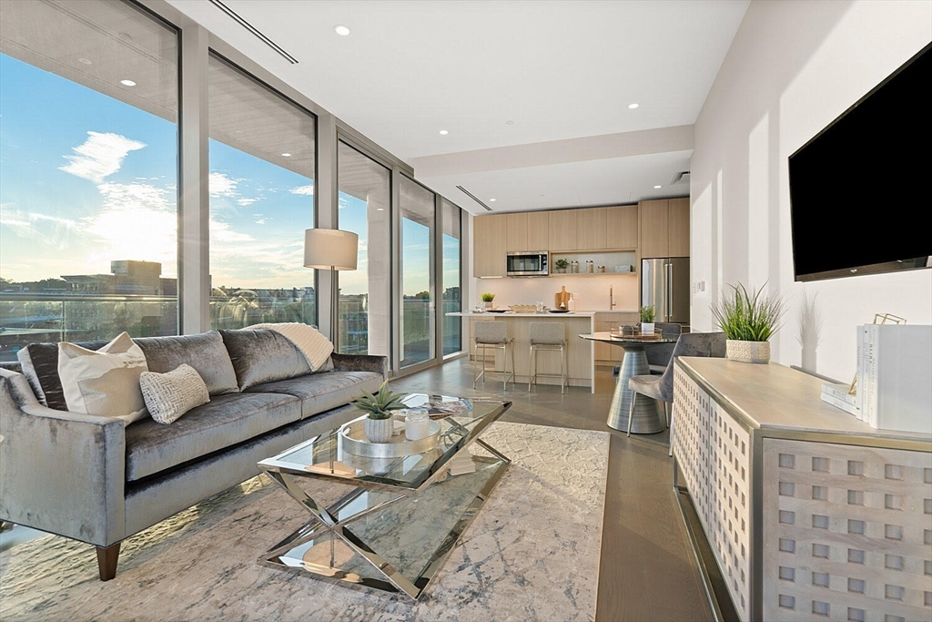 a living room with fireplace furniture and a flat screen tv