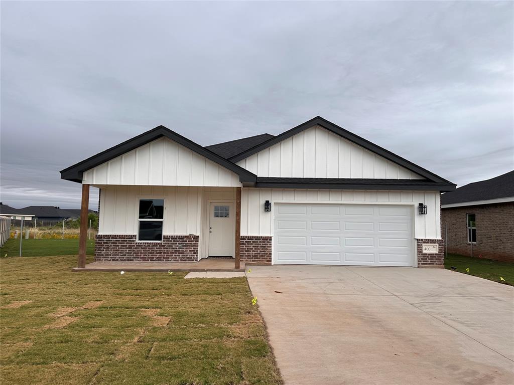 400 Gunsight Ridge Abilene, TX 79602 - Photo 1 of 1 a front view of a house with a yard and garage