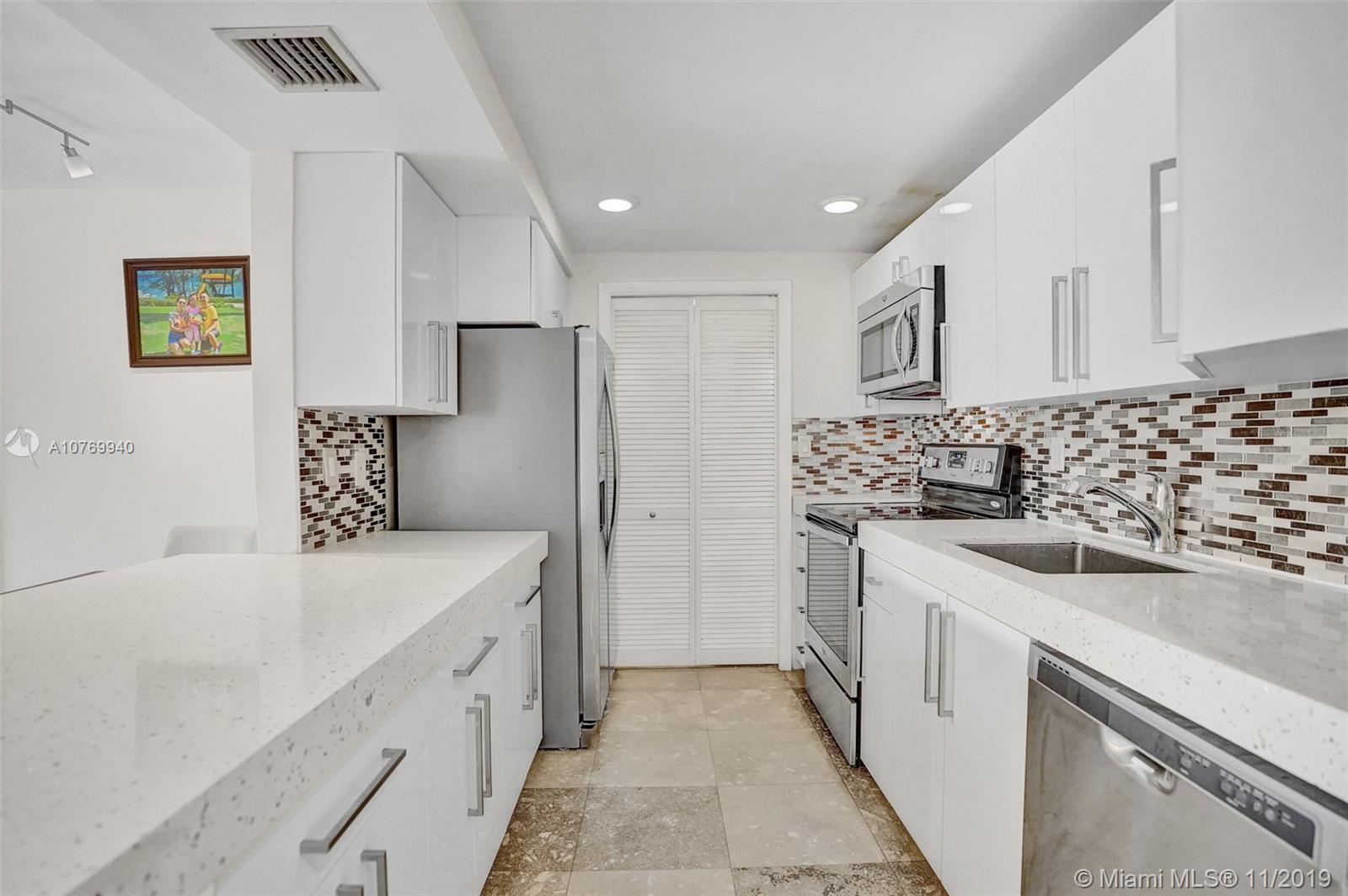 Upgraded Kitchen with Quartz Countertops, Stone Backsplash and Stainless Steel Appliances