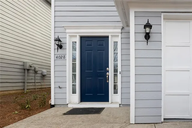a view of front door and a window