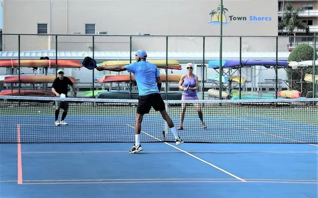 a view of a swimming pool with a table and chairs