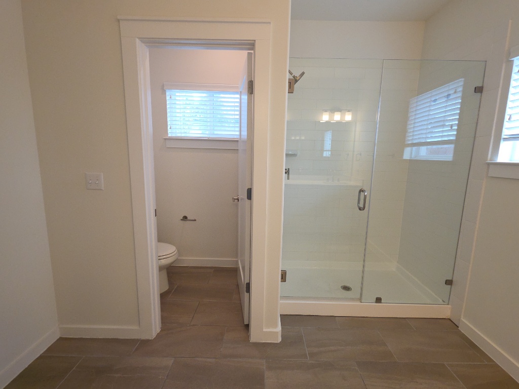6800 Menchaca Road, Unit 42 Austin, TX 78745 - Photo 12 of 23 Primary bathroom with walk-in shower