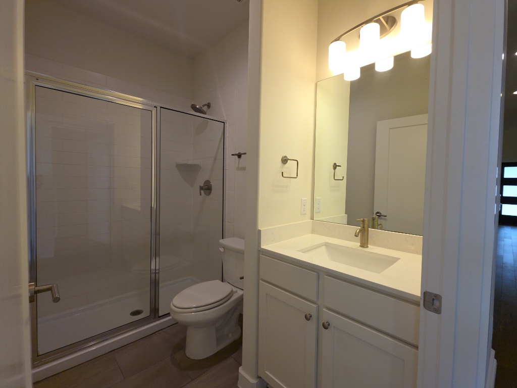 6800 Menchaca Road, Unit 42 Austin, TX 78745 - Photo 17 of 23 Full bathroom with vanity and walk-in shower
