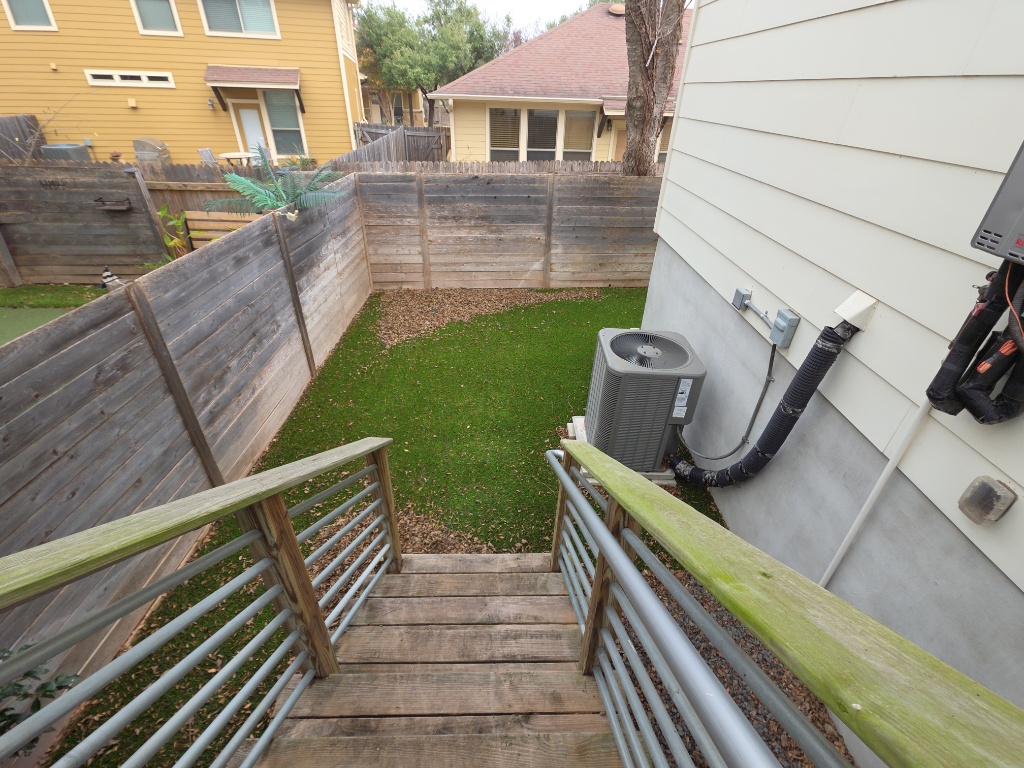 6800 Menchaca Road, Unit 42 Austin, TX 78745 - Photo 22 of 23 Deck stairs to backyard space