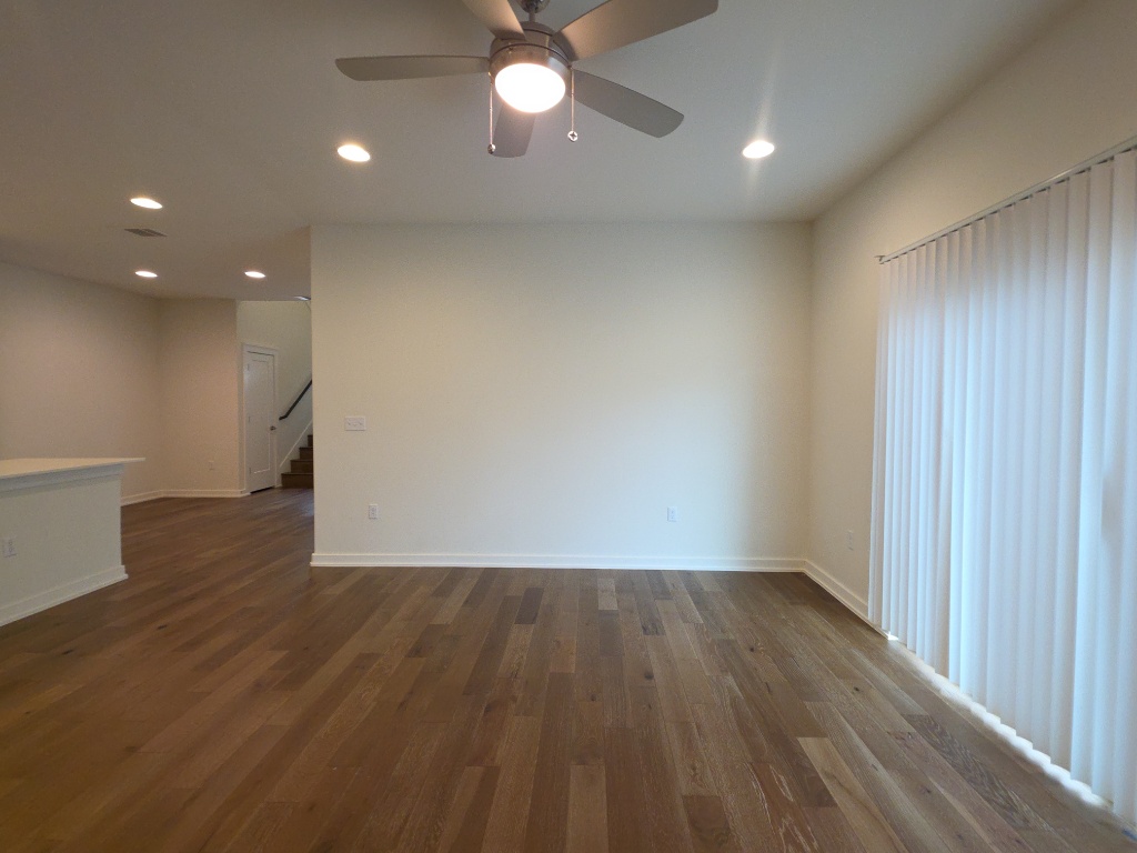 6800 Menchaca Road, Unit 42 Austin, TX 78745 - Photo 4 of 23 Living room with ceiling fan and lots of natural light