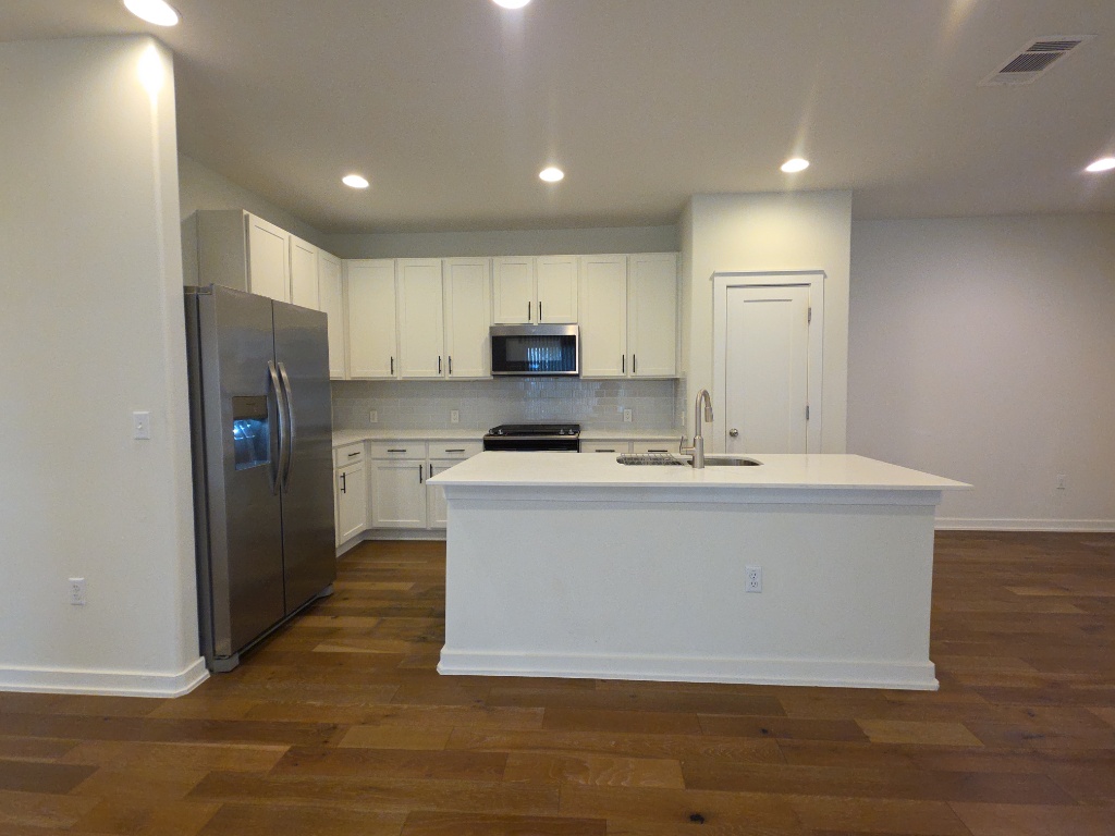 6800 Menchaca Road, Unit 42 Austin, TX 78745 - Photo 7 of 23 Kitchen with large island