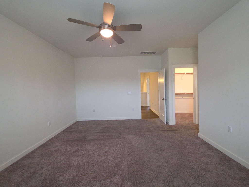 6800 Menchaca Road, Unit 42 Austin, TX 78745 - Photo 9 of 23 Primary bedroom with en suite bathroom and large closet