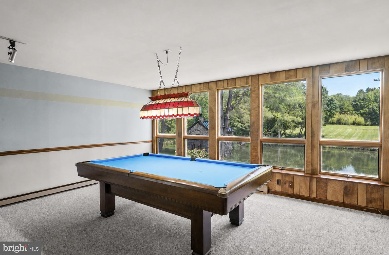 108 Sheeder Road Phoenixville, PA 19460 - Photo 15 of 42 a room with pool table windows and a chandelier