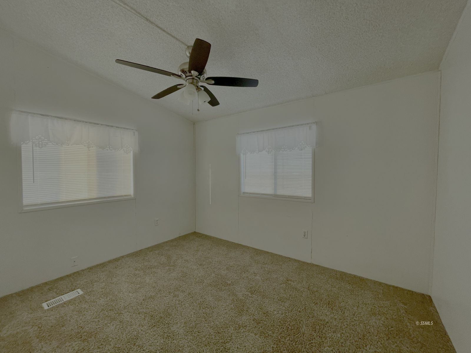 1465 Pony Street Ridgecrest, CA 93555 - Photo 21 of 32 an empty room with a window and a fan