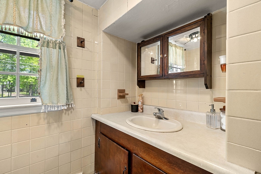 600 Main Street Ashby, MA 01431 - Photo 15 of 40 a bathroom with a sink and a mirror