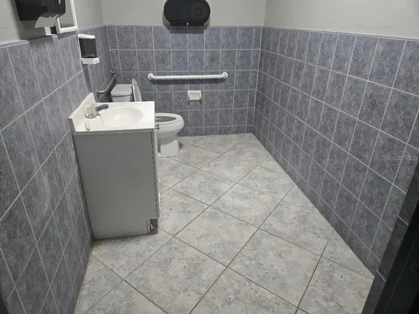 a room with furniture and gym equipment