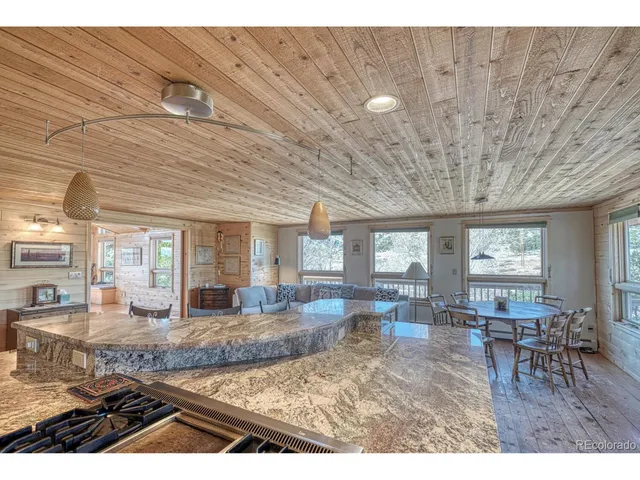 a bedroom with furniture and a wooden floor