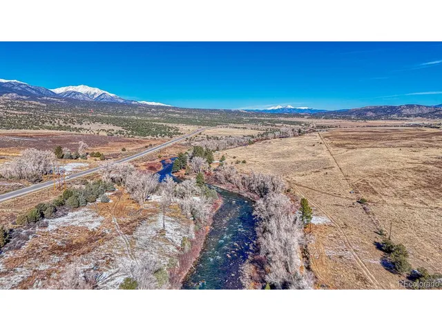 a view of a big yard with lots of green space