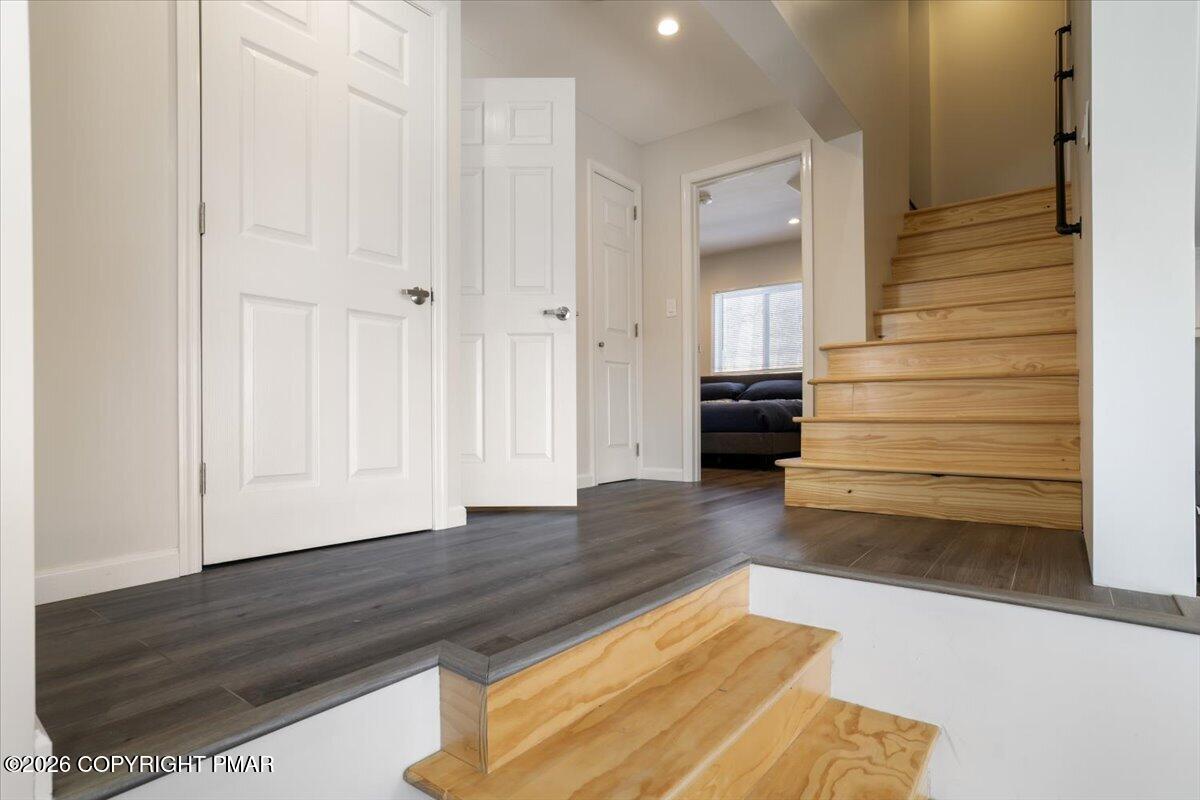 5873 Decker Road Bushkill, PA 18324 - Photo 29 of 57 a view of a hallway with wooden floor and stairs