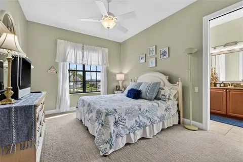 a bedroom with a bed window and a fireplace