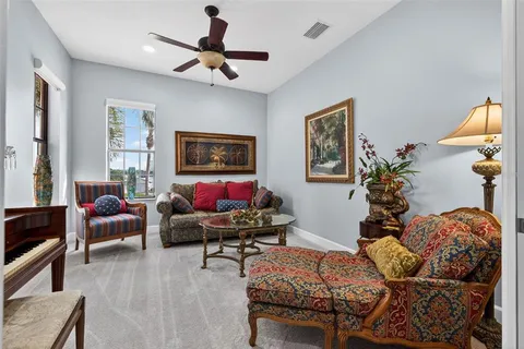 a bathroom with a granite countertop sink a toilet and a mirror