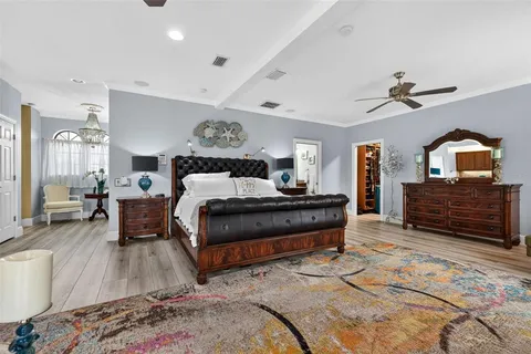a dining room with furniture and a floor to ceiling window