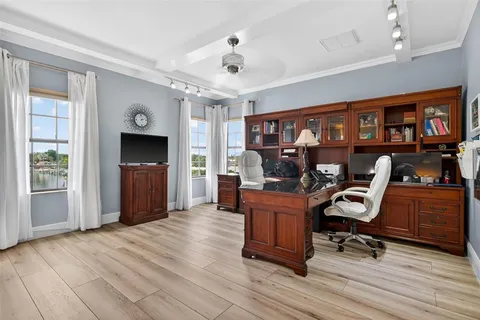 a living room with furniture fireplace and flat screen tv