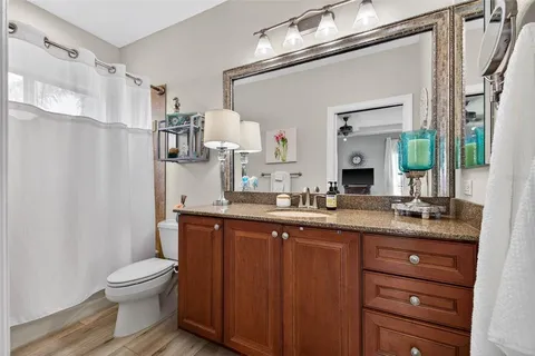 a view of a swimming pool with a lounge chair