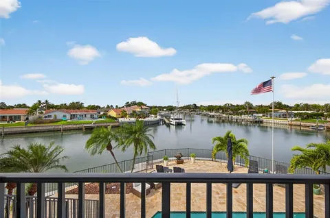 a view of a swimming pool with outdoor seating