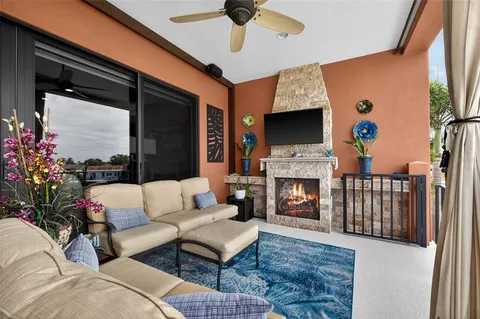 a view of a swimming pool with a table and chairs