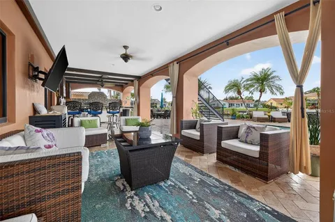 a room with pool table windows and wooden floor