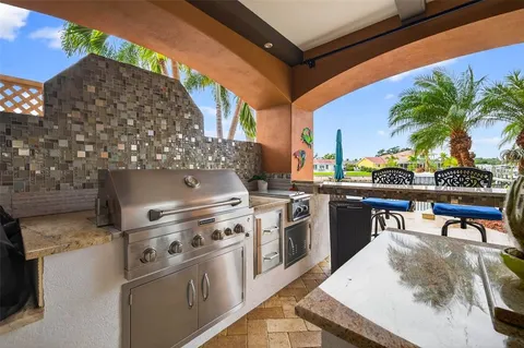 a view of a swimming pool with lawn chairs