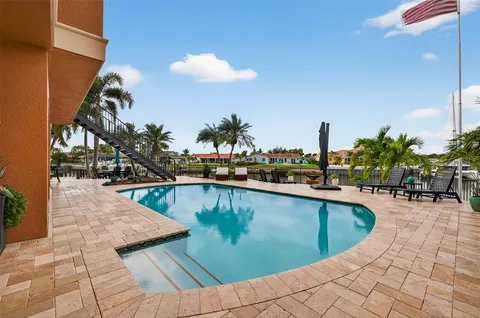 a black and white photo of a white house with a white wall