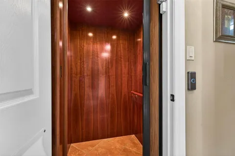 a kitchen with stainless steel appliances granite countertop a refrigerator a sink and a stove