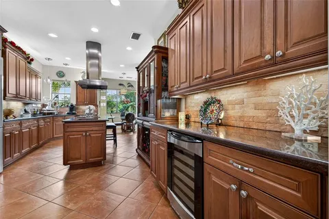 a dining room with furniture a flat screen tv and a window