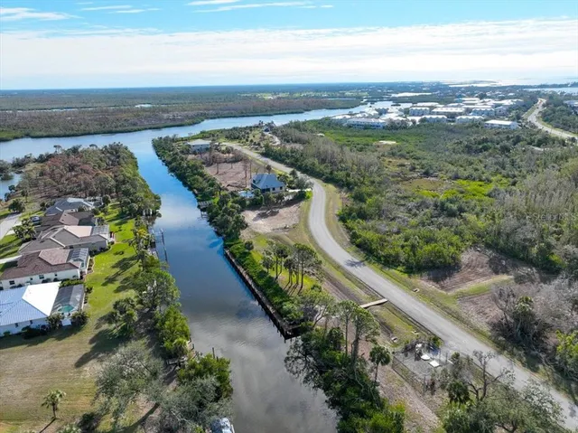 an aerial view of a city with mountains