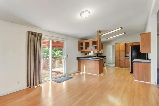 a kitchen with a refrigerator and a sink