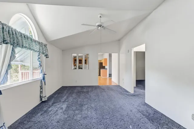 a view of an empty room with a window