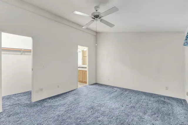 a bathroom with a tub a sink and a large mirror