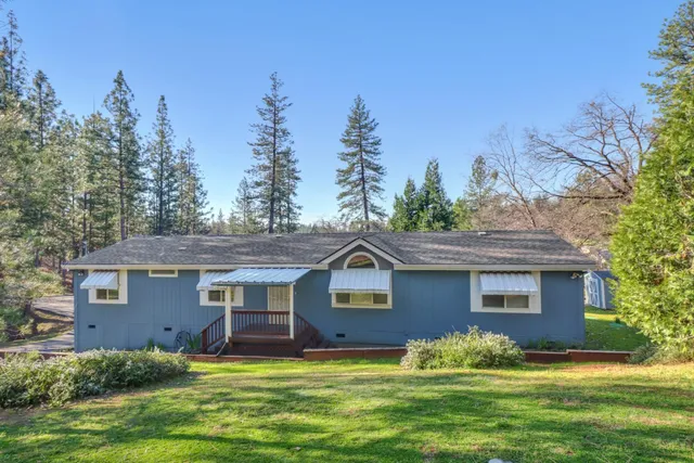 a front view of a house with a yard