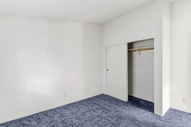 a kitchen with stainless steel appliances granite countertop a stove and a refrigerator