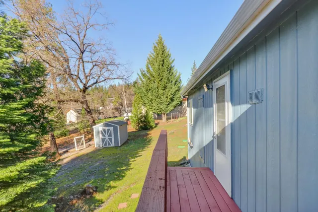a view of a house with a yard and garage