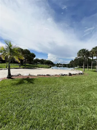 a view of a lake with houses in the background