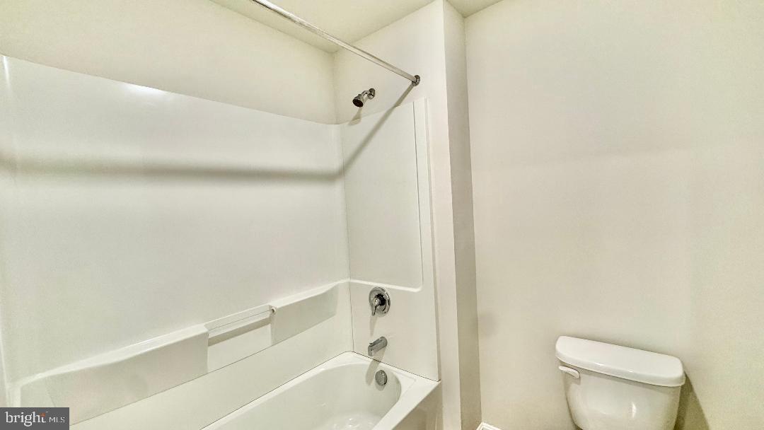 1236 Pimpernell Path Middletown, DE 19709 - Photo 24 of 37 a bathroom with a toilet and a bathtub