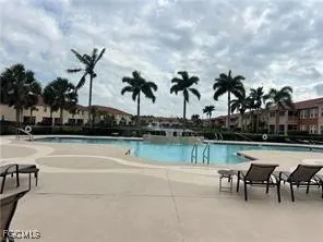 a view of a swimming pool with a table and chairs